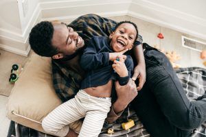 Father and son playing together with healthy hips